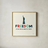 Freedom Liberty by Michael Mullan. Shown in a natural wood glass frame for a timeless modern aesthetic. Available as an archival giclee rolled canvas, fine art paper, or poster print. SKU 99013a.