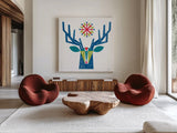 Geometric Holiday Reindeer II Bright by Michael Mullan. Shown as extra-large giant wall art in a modern living room. Available as an archival giclee rolled canvas, fine art paper, or poster print. SKU 56255a.