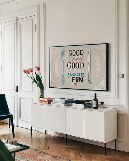 Good Food Friends Fun Horizontal by Michael Mullan. shown as a framed stretched canvas in a living room above a console. Available as a archival giclee rolled canvas, fine art paper, or poster print. SKU 18693i.