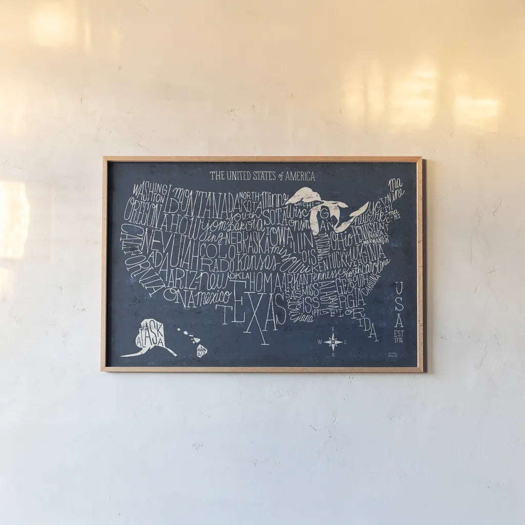 Hand Lettered US Map Blueprint by Michael Mullan. shown as a paper print in a natural frame. Available as a archival giclee rolled canvas, fine art paper, or poster print. SKU 16524i.