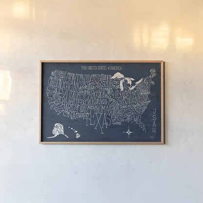 Hand Lettered US Map Blueprint by Michael Mullan. shown as a paper print in a natural frame. Available as a archival giclee rolled canvas, fine art paper, or poster print. SKU 16524i.