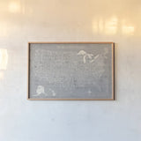 Hand Lettered USA Map Gray by Michael Mullan. shown as a paper print in a natural frame. Available as a archival giclee rolled canvas, fine art paper, or poster print. SKU 43245i.