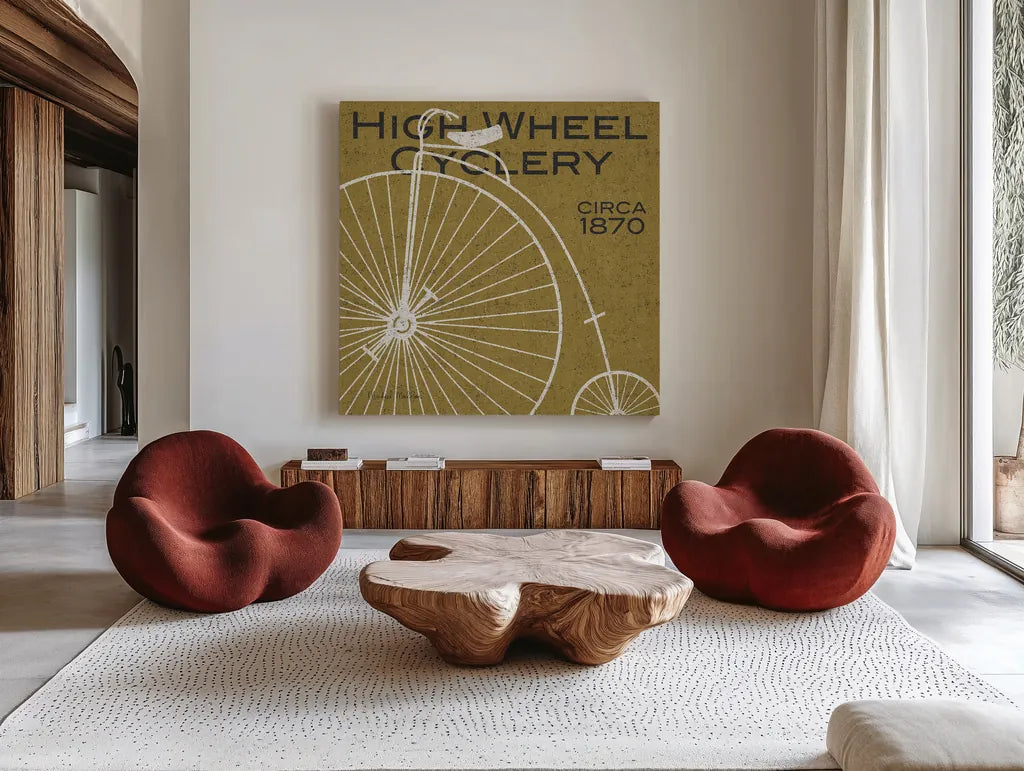 High Wheel Cyclery by Michael Mullan. Shown as extra-large giant wall art in a modern living room. Available as an archival giclee rolled canvas, fine art paper, or poster print. SKU 11869a.