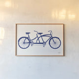 Lets Cruise Bicycle by Michael Mullan. shown as a paper print in a natural frame. Available as a archival giclee rolled canvas, fine art paper, or poster print. SKU 87838i.