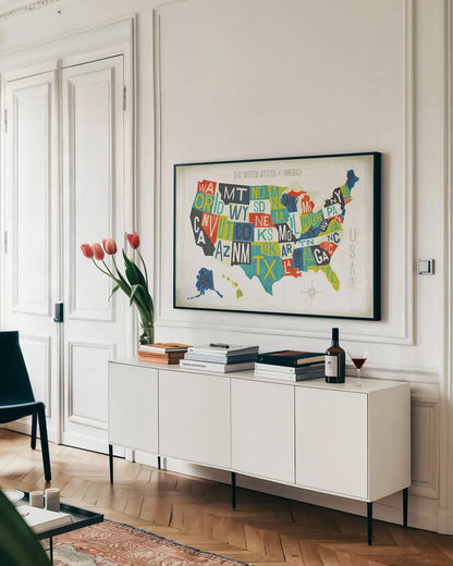 Letterpress USA Map by Michael Mullan. shown as a framed stretched canvas in a living room above a console. Available as a archival giclee rolled canvas, fine art paper, or poster print. SKU 29789i.