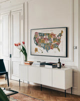 Letterpress USA Map Warm by Michael Mullan. shown as a framed stretched canvas in a living room above a console. Available as a archival giclee rolled canvas, fine art paper, or poster print. SKU 58963i.