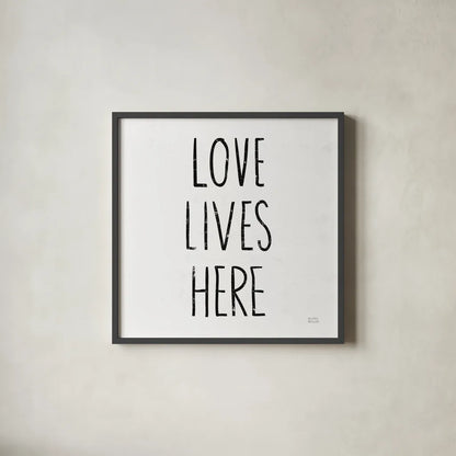 Love Lives Here Sq BW by Michael Mullan. Shown in a sleek black glass frame for a contemporary gallery look. Available as an archival giclee rolled canvas, fine art paper, or poster print. SKU 54656a.