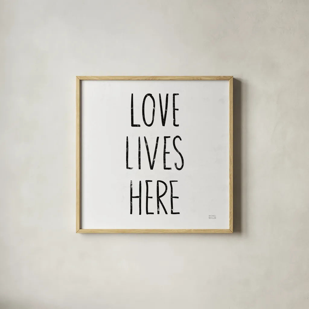 Love Lives Here Sq BW by Michael Mullan. Shown in a natural wood glass frame for a timeless modern aesthetic. Available as an archival giclee rolled canvas, fine art paper, or poster print. SKU 54656a.