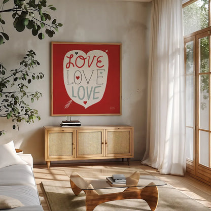 Love Love Love Square by Michael Mullan. Shown in a natural wood frame in a cozy modern living room. Available as an archival giclee rolled canvas, fine art paper, or poster print. SKU 11821a.