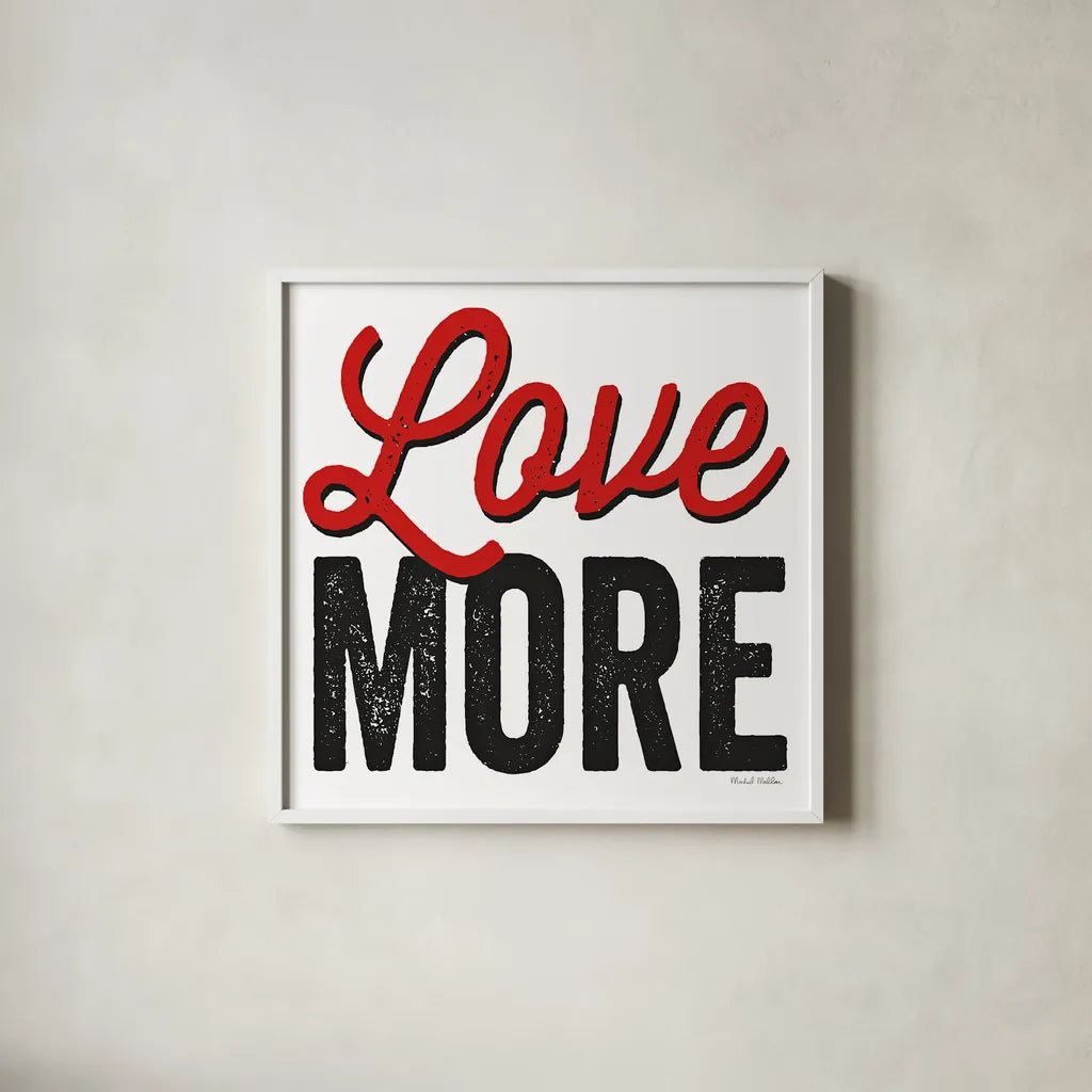 Love More on White by Michael Mullan. Shown in a crisp white glass frame for a clean and minimalist style. Available as an archival giclee rolled canvas, fine art paper, or poster print. SKU 30984a.