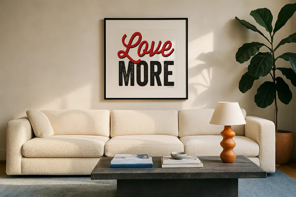 Love More on White by Michael Mullan. Displayed in a glass frame with matte in a clean modern living room. Available as an archival giclee rolled canvas, fine art paper, or poster print. SKU 30984a.