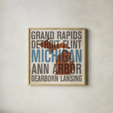 Michigan by Michael Mullan. Shown in a natural wood glass frame for a timeless modern aesthetic. Available as an archival giclee rolled canvas, fine art paper, or poster print. SKU 18066a.