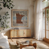 Minnesota by Michael Mullan. Shown in a natural wood frame in a cozy modern living room. Available as an archival giclee rolled canvas, fine art paper, or poster print. SKU 18067a.