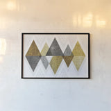 Mod Triangles II Gold by Michael Mullan. shown as a paper print in a black flame. Available as a archival giclee rolled canvas, fine art paper, or poster print. SKU 22302i.