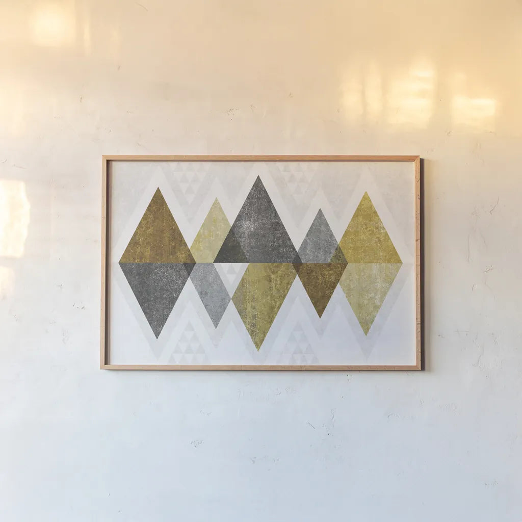 Mod Triangles II Gold by Michael Mullan. shown as a paper print in a natural frame. Available as a archival giclee rolled canvas, fine art paper, or poster print. SKU 22302i.