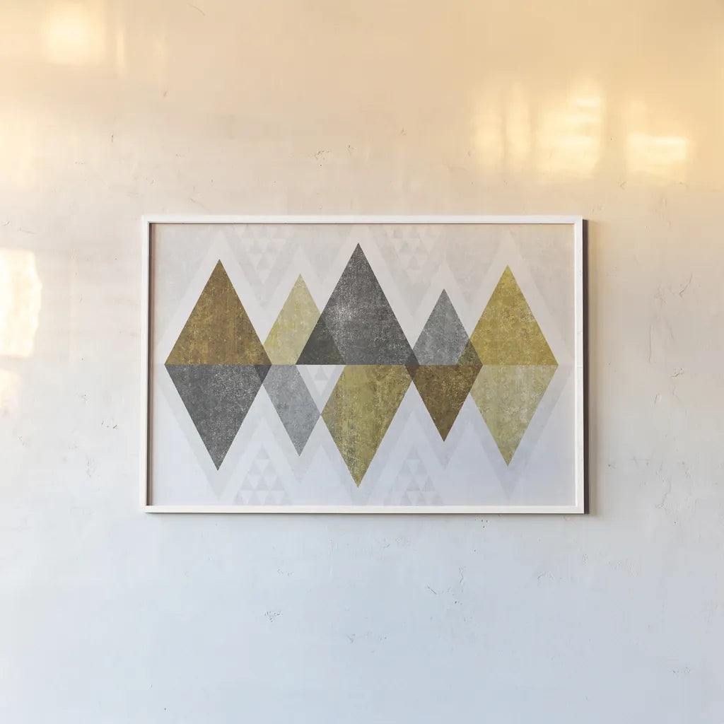 Mod Triangles II Gold by Michael Mullan. shown as a paper print in a white frame. Available as a archival giclee rolled canvas, fine art paper, or poster print. SKU 22302i.