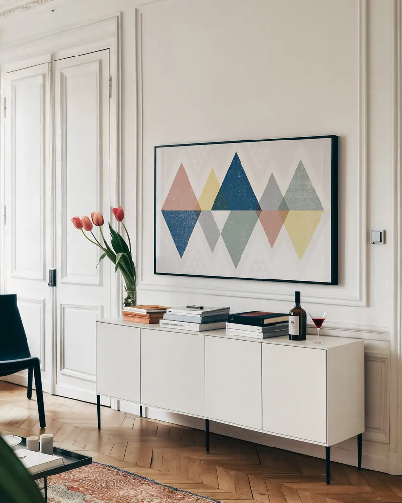 Mod Triangles II Soft by Michael Mullan. shown as a framed stretched canvas in a living room above a console. Available as a archival giclee rolled canvas, fine art paper, or poster print. SKU 33788i.
