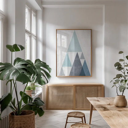 Mod Triangles III Blue by Michael Mullan. shown as a print in a natural wood frame in a dining room. Available as a archival giclee rolled canvas, fine art paper, or poster print. SKU 22295h.