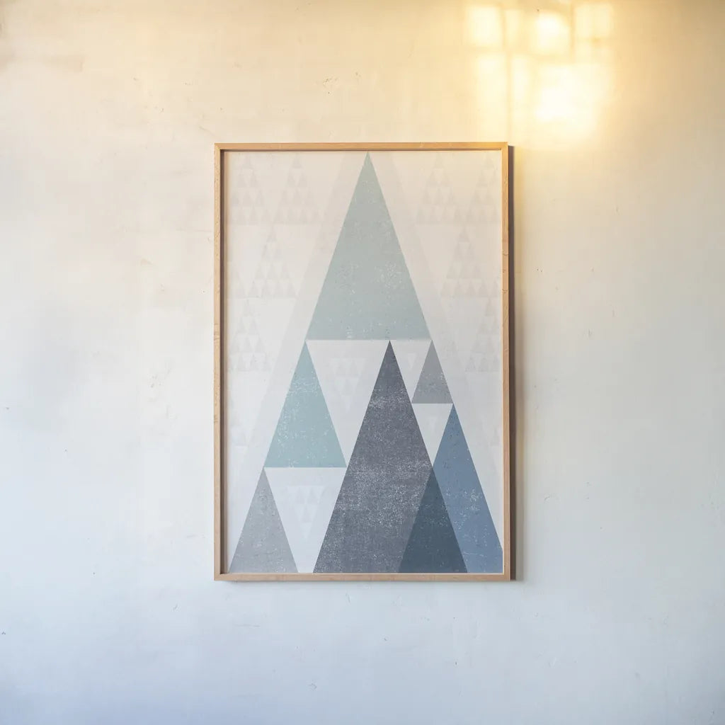 Mod Triangles III Blue by Michael Mullan. shown as a paper print in a natural frame. Available as a archival giclee rolled canvas, fine art paper, or poster print. SKU 22295h.