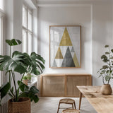 Mod Triangles III Gold by Michael Mullan. shown as a print in a natural wood frame in a dining room. Available as a archival giclee rolled canvas, fine art paper, or poster print. SKU 22303h.