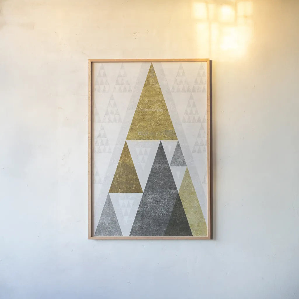 Mod Triangles III Gold by Michael Mullan. shown as a paper print in a natural frame. Available as a archival giclee rolled canvas, fine art paper, or poster print. SKU 22303h.