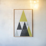 Mod Triangles III Yellow Black by Michael Mullan. shown as a paper print in a natural frame. Available as a archival giclee rolled canvas, fine art paper, or poster print. SKU 64128h.