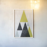 Mod Triangles III Yellow Black by Michael Mullan. shown as a paper print in a white frame. Available as a archival giclee rolled canvas, fine art paper, or poster print. SKU 64128h.