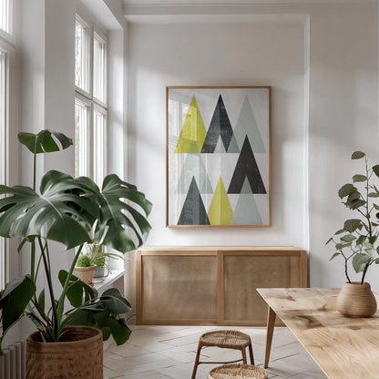 Mod Triangles IV Yellow Black by Michael Mullan. shown as a print in a natural wood frame in a dining room. Available as a archival giclee rolled canvas, fine art paper, or poster print. SKU 64129h.