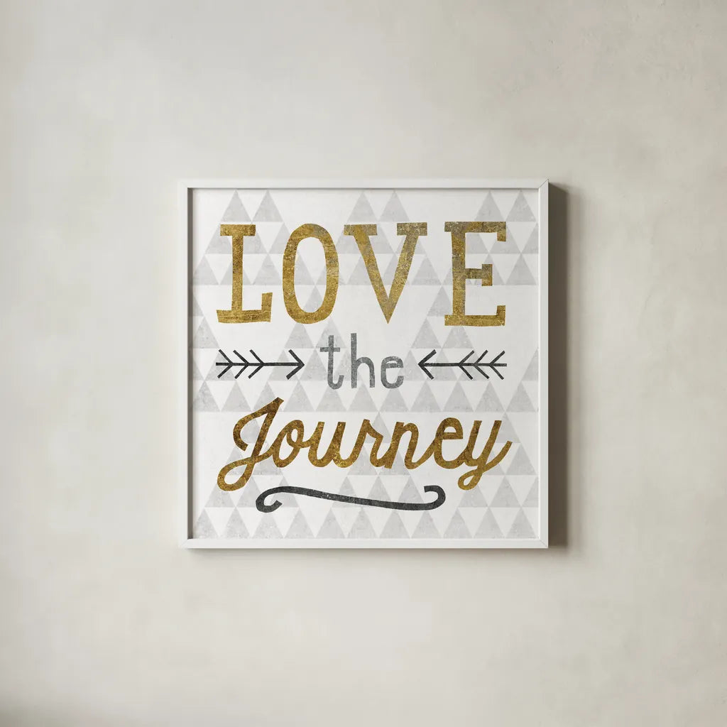 Mod Triangles Love the Journey Gold by Michael Mullan. Shown in a crisp white glass frame for a clean and minimalist style. Available as an archival giclee rolled canvas, fine art paper, or poster print. SKU 22300a.