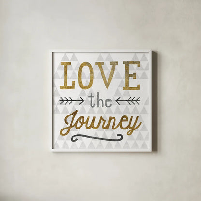 Mod Triangles Love the Journey Gold by Michael Mullan. Shown in a crisp white glass frame for a clean and minimalist style. Available as an archival giclee rolled canvas, fine art paper, or poster print. SKU 22300a.