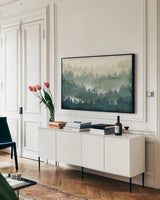 Mountainscape by Michael Mullan. shown as a framed stretched canvas in a living room above a console. Available as a archival giclee rolled canvas, fine art paper, or poster print. SKU 22465i.