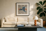 New York V2 by Michael Mullan. Displayed in a glass frame with matte in a clean modern living room. Available as an archival giclee rolled canvas, fine art paper, or poster print. SKU 18070a.