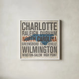 North Carolina by Michael Mullan. Shown in a crisp white glass frame for a clean and minimalist style. Available as an archival giclee rolled canvas, fine art paper, or poster print. SKU 18071a.