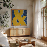Punctuated Square II Bright by Michael Mullan. Shown in a natural wood frame in a cozy modern living room. Available as an archival giclee rolled canvas, fine art paper, or poster print. SKU 56574a.