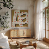 Punctuated Square IX Retro by Michael Mullan. Shown in a natural wood frame in a cozy modern living room. Available as an archival giclee rolled canvas, fine art paper, or poster print. SKU 50664a.