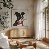 Puppy Love I by Michael Mullan. Shown in a natural wood frame in a cozy modern living room. Available as an archival giclee rolled canvas, fine art paper, or poster print. SKU 8340a.