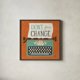 Retro Desktop Typewriter Don't Fear Change by Michael Mullan. Shown in a sleek black glass frame for a contemporary gallery look. Available as an archival giclee rolled canvas, fine art paper, or poster print. SKU 65001a.