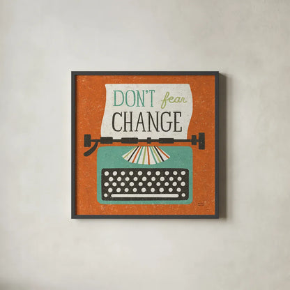 Retro Desktop Typewriter Don't Fear Change by Michael Mullan. Shown in a sleek black glass frame for a contemporary gallery look. Available as an archival giclee rolled canvas, fine art paper, or poster print. SKU 65001a.