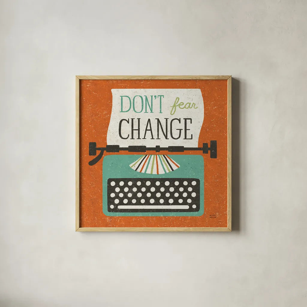 Retro Desktop Typewriter Don't Fear Change by Michael Mullan. Shown in a natural wood glass frame for a timeless modern aesthetic. Available as an archival giclee rolled canvas, fine art paper, or poster print. SKU 65001a.