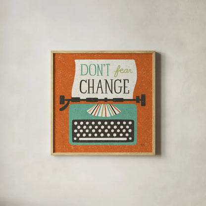 Retro Desktop Typewriter Don't Fear Change by Michael Mullan. Shown in a natural wood glass frame for a timeless modern aesthetic. Available as an archival giclee rolled canvas, fine art paper, or poster print. SKU 65001a.