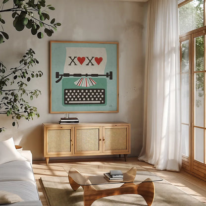 Retro Desktop Typewriter Love by Michael Mullan. Shown in a natural wood frame in a cozy modern living room. Available as an archival giclee rolled canvas, fine art paper, or poster print. SKU 51372a.