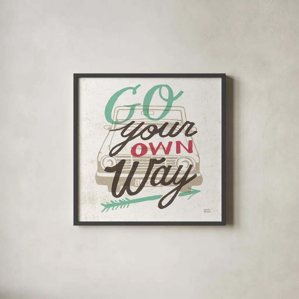 Road Trip Go Your Own Way by Michael Mullan. Shown in a sleek black glass frame for a contemporary gallery look. Available as an archival giclee rolled canvas, fine art paper, or poster print. SKU 19883a.