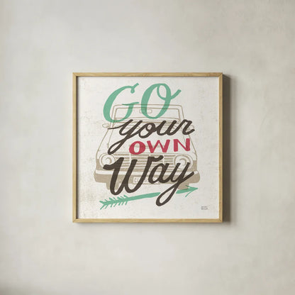 Road Trip Go Your Own Way by Michael Mullan. Shown in a natural wood glass frame for a timeless modern aesthetic. Available as an archival giclee rolled canvas, fine art paper, or poster print. SKU 19883a.