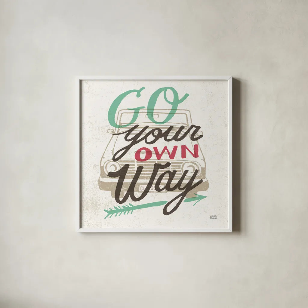Road Trip Go Your Own Way by Michael Mullan. Shown in a crisp white glass frame for a clean and minimalist style. Available as an archival giclee rolled canvas, fine art paper, or poster print. SKU 19883a.