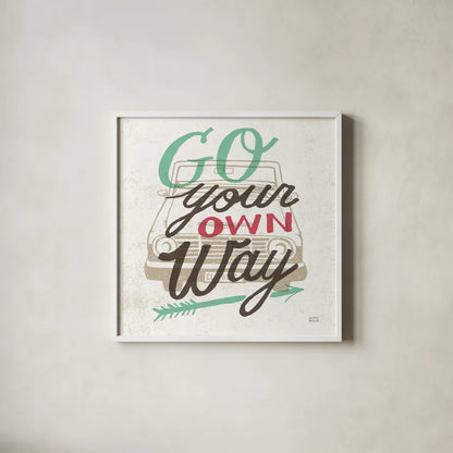 Road Trip Go Your Own Way by Michael Mullan. Shown in a crisp white glass frame for a clean and minimalist style. Available as an archival giclee rolled canvas, fine art paper, or poster print. SKU 19883a.