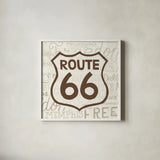 Road Trip Route 66 Brown by Michael Mullan. Shown in a crisp white glass frame for a clean and minimalist style. Available as an archival giclee rolled canvas, fine art paper, or poster print. SKU 32583a.