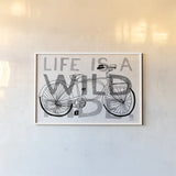 Road Trip Wild Ride BW by Michael Mullan. shown as a paper print in a white frame. Available as a archival giclee rolled canvas, fine art paper, or poster print. SKU 32586i.