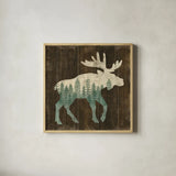 Simple Living Moose Silhouette by Michael Mullan. Shown in a natural wood glass frame for a timeless modern aesthetic. Available as an archival giclee rolled canvas, fine art paper, or poster print. SKU 69300a.