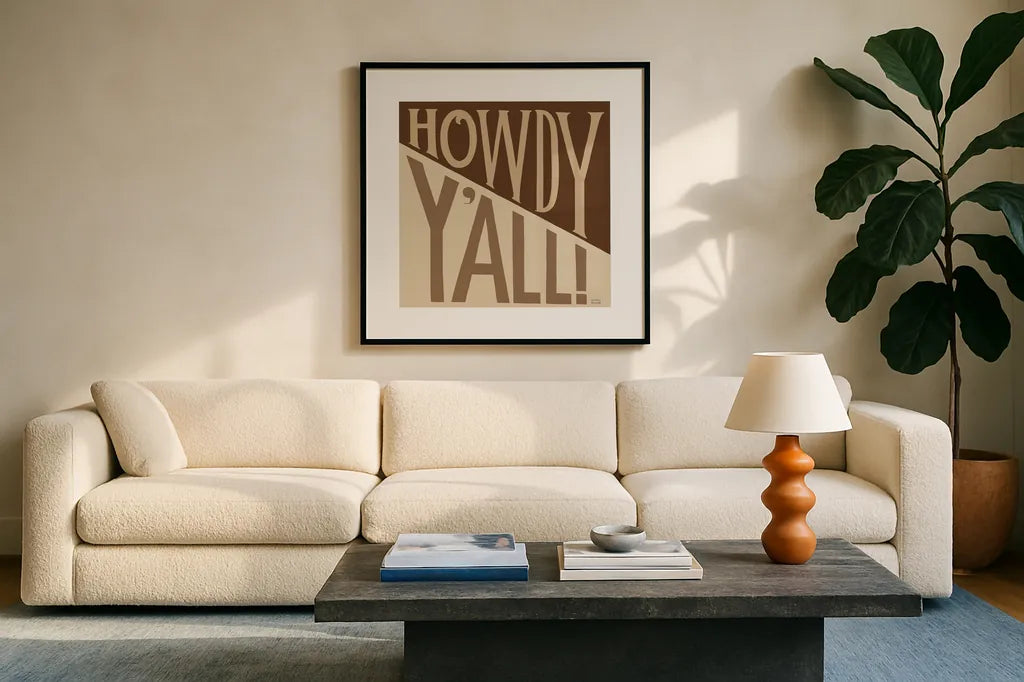 Southern Pride Sayings Howdy Yall Tan by Michael Mullan. Displayed in a glass frame with matte in a clean modern living room. Available as an archival giclee rolled canvas, fine art paper, or poster print. SKU 88699a.