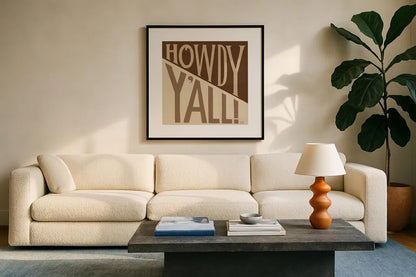 Southern Pride Sayings Howdy Yall Tan by Michael Mullan. Displayed in a glass frame with matte in a clean modern living room. Available as an archival giclee rolled canvas, fine art paper, or poster print. SKU 88699a.
